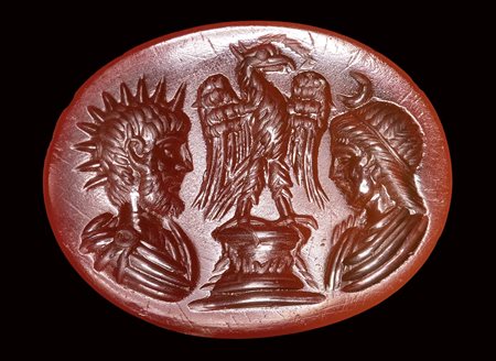 A roman carnelian intaglio. Two private portraits as Helios and Selene, with an eagle.<br><br>End of 1st century A.D. - early 2nd century A.D.