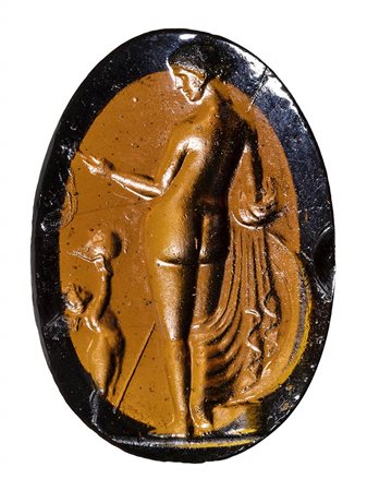 A Grand Tour brownish glass impression. Venus Victrix. <br><br>19th century.