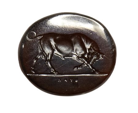 A brownish glass impression. Bull.<br><br>19th century.