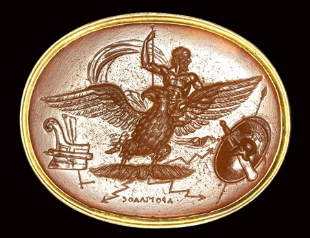 A fine neoclassical Poniatowski  carnelian intaglio signed Arogillos, set in a gold frame. Allegory of the universal power of Zeus. 19th century. 