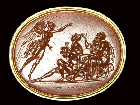 A fine neoclassical Poniatowski  carnelian intaglio signed Dioskourides, set in a gold frame. Iris sent by Zeus commanding Priam. 19th century.