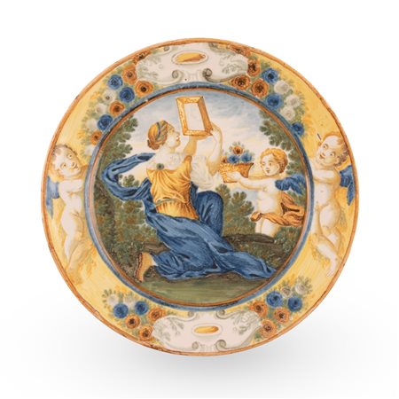 Castelli, bottega Gentile, metà del XVIII secolo ( - ) 
Piattello in maiolica istoriato con scena mitologica (toletta di Venere) 
 Ø cm 17