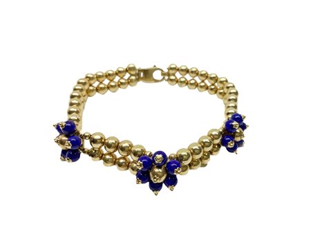 
 
 29.1 gr. Bracciale a due fili a lavorazione a sfera di perline in oro giallo e pietre blu 