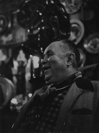 Robert Doisneau (1912-1994)  - Laughing man in a bar in Paris, 1950s