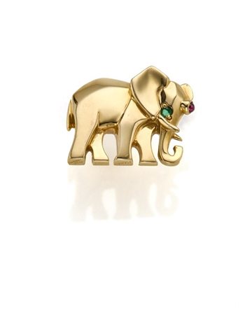 CARTIER
Pin in oro giallo a guisa di elefante, uno smeraldo per l'occhio e un r