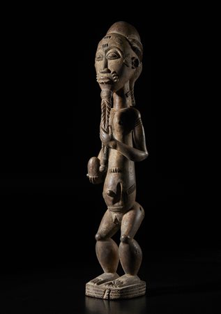  Arte africana - Costa d'Avorio, Baule. 
Figura del mondo parallelo Blolo Bla.
Legno con tracce di offerte. 
Prima metà del XX sec. .