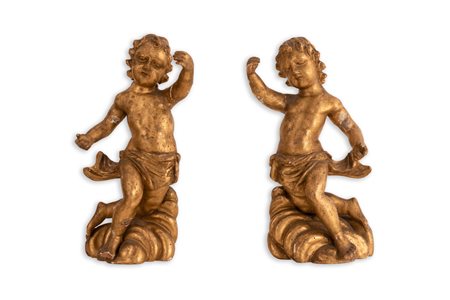    Coppia di putti reggicandela in legno dorato XVII secolo