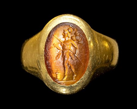A ROMAN CARNELIAN INTAGLIO SET IN A GOLD RING. MARS GRADIVUS. 