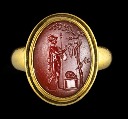  A FINE ROMAN CARNELIAN INTAGLIO SET IN A MODERN GOLD RING. JASON AND THE GOLDEN FLEECE. 