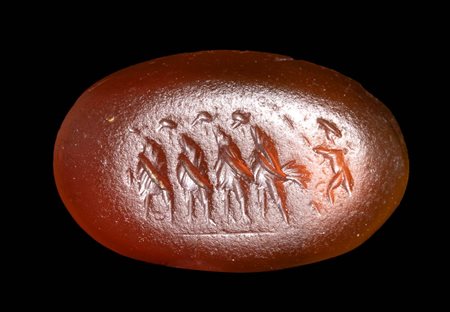 A ROMAN CARNELIAN INTAGLIO. EROS LEADING A GROUP OF FOUR ROOSTERS. 