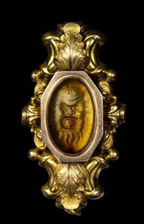 A FINE ANCIENT CARNELIAN INTAGLIO SIGNED AYLOY SET IN A GOLD BROOCH. A DIONYSIAC MASK WITH A GORGONA MASK INSIDE THE MOUTH. 
