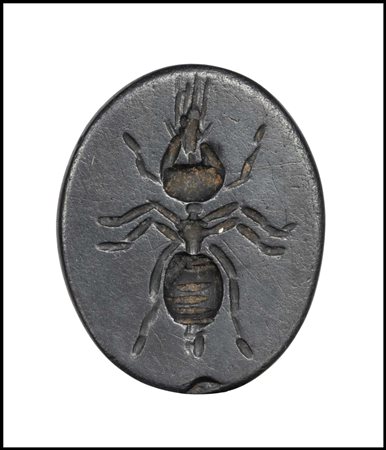 A ROMAN GNOSTIC HEMATITE INTAGLIO. ANT AND HELIOS-HORUS-MIÔS SEATED ON A LION.