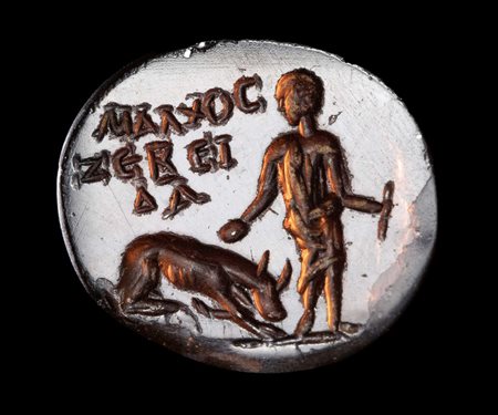 A ROMAN GARNET INTAGLIO. YOUNG SHEPHERD WITH HIS DOG AND GREEK INSCRIPTIONS.