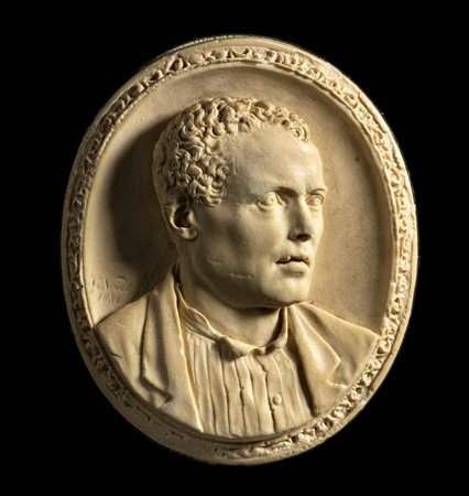 A LARGE LIMESTONE SIGNED AND DATED CAMEO SET IN A METALIC FRAME. MALE PORTRAIT. 