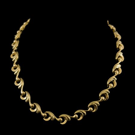 Collana in oro giallo 18kt. con maglie a motivi vegetali stilizzati, Anni...