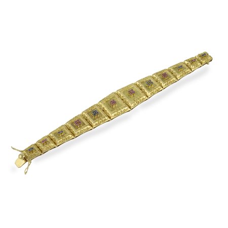 Bracciale in oro giallo 18kt. con maglie quadrangolari degradanti centrate da...