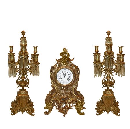 Trittico barocco composto da orologio da tavolo e due candelabri a 8 luci, 20 century