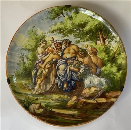 Manifattura Mollica. Piatto in maiolica dipinta in policromia con scena bacchic