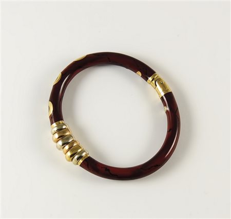 BRACCIALE RIGIDO IN ORO GIALLO E SMALTI Anni Novanta impeziosito da cerchi in...