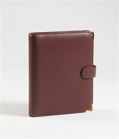 CARTIER - Agenda in pelle bordeaux.