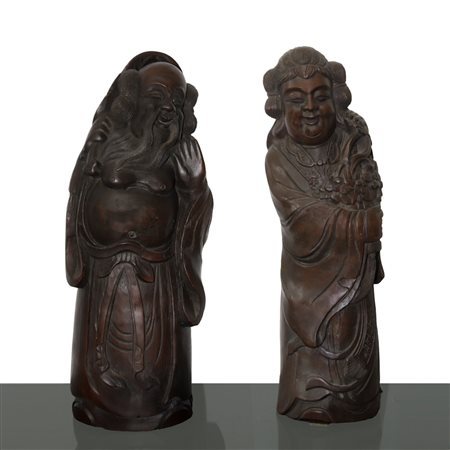 Coppia di sculture in legno di bamboo raffiguranti un uomo e una donna