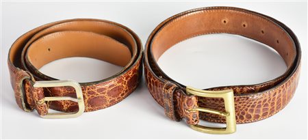 CROCODILE BELTS DESCRIPTION: A pair of crocodile leather belts. Made in...