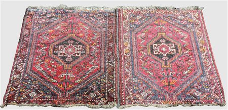 COPPIA DI TAPPETI CAUCASICI SCENDILETTO - PAIR OF CAUCASIAN RUGS fondo rosso,...