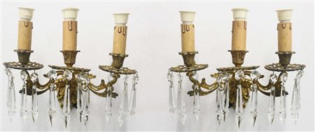 Coppia di applique in metallo dorato a tre luci, 19° secolo
