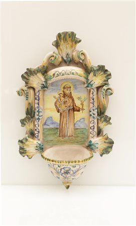 Manifattura di Ariano Arpino. Acquasantiera in maiolica decorata con l'immagne di Sant'Antonio Abate e il Bambin Gesù   