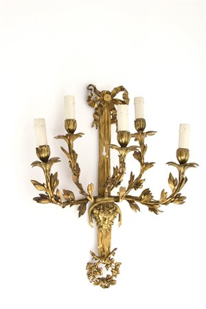 Sconces in gilt bronze