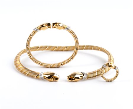 CARTIER  
Parure panthère composta da girocollo, bracciale ed anello in oro e diamanti Anni '90
 