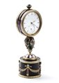 FABERGÉ CARL (Saint Petersburg, 30/05/1846 - Lausanne, 24/09/1920) 
Orologio da tavolo in argento dorato e smalti Anni '10 - '20
 Altezza x larghezza x profondità: 13 x 4,8 x 4,3 cm. Peso: 272 gr.