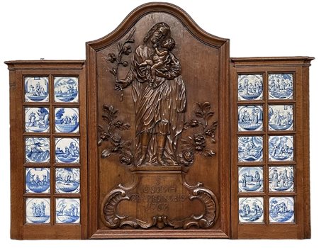 A capital oak mantelpiece depicting St. Joseph with Christ Child. "St. Joseph...