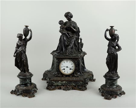 A green marble Garniture de Cheminée, on the clock a bronze figure of a...