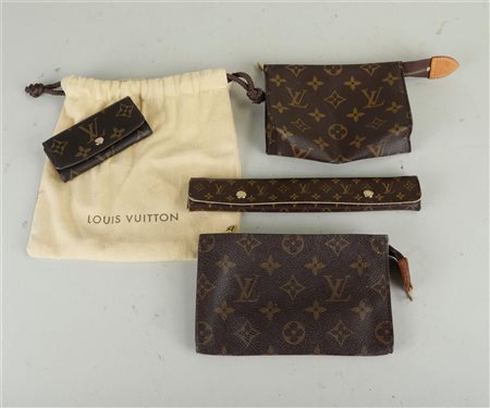 A lot consisting of (4) Louis Vuitton travel items. Including a key case, (2)...