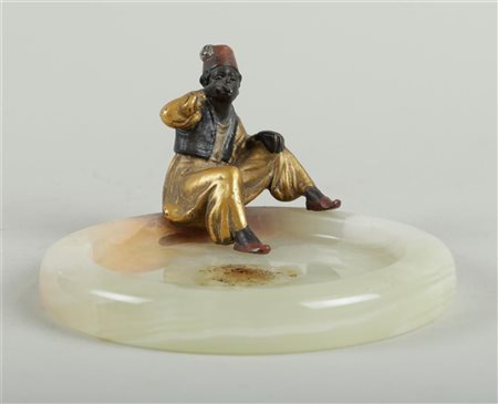 A Viennese, vide poche with cold painted bronze 'Smoking Arab boy', marked in...