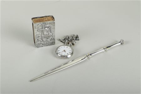 A lot consisting of a silver pocket watch, a silver-plated letter opener, and...