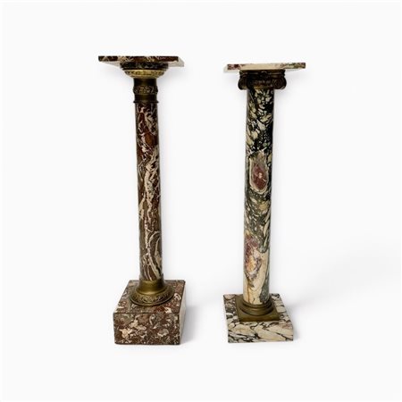 A lot consisting of (2) marble columns / pedestals with brass capitals. Italy...