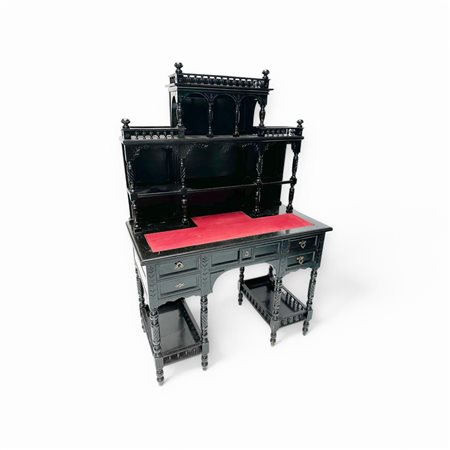 A blackened wooden secretary on turned legs. France ca. 1900.