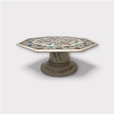 A Pietra Dura coffee table on a marble leg. The Pietra Dura embellished with...