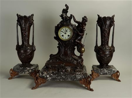 An Art Nouveau Garniture de Cheminée on a marble base with brass mounts....