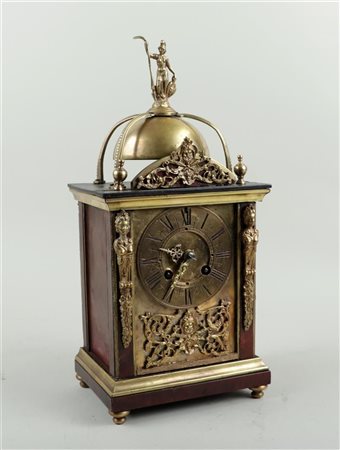 A tortoiseshell glued table clock with bronze ornaments on ball feet and...