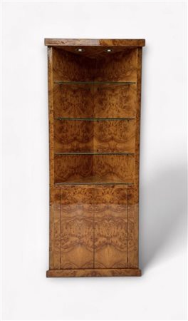 A high-gloss lacquered veneered cupboard with two handleless doors at the...