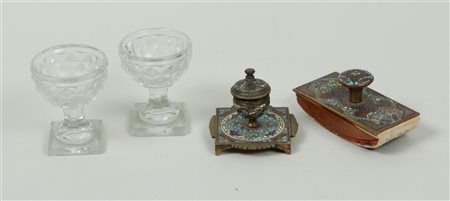 A bronze Champlevé desk set, with two cut coupes. The coupes have a chip at...