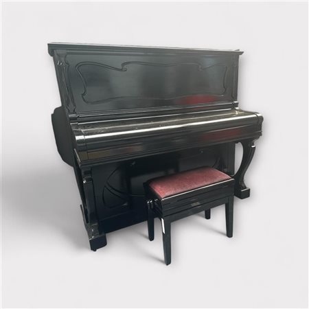 A black polished Pleyela acoustic practice piano with stool, needs to be...