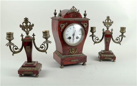 A tortoiseshell veneered clock set with bronze mounts. France, 19th century.