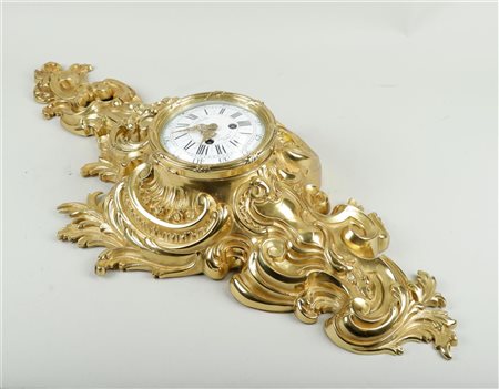 A large gilt rococo style cartel clock, signed on the dial 'A LA GERBE D'OR'...