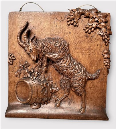 A wooden panel depicting a Goat with Wine Barrels and Grape Vines. France,...