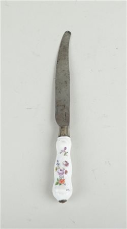 A knife with a Meissen porcelain handle decorated with floral decoration....