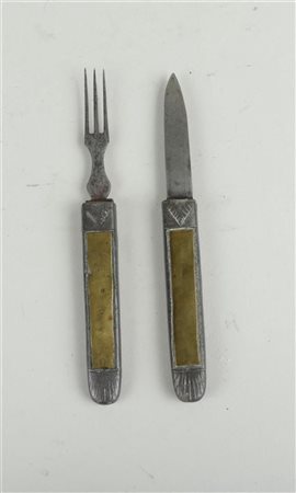 An antique English travel cutlery set consisting of a fork and knife with...